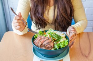 woman-eating-steak-salad.jpg