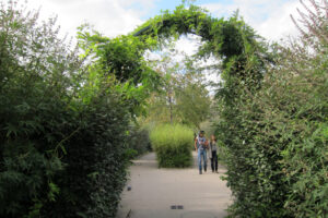 promenade-plantee-walking-thru-arches-grasses.jpg